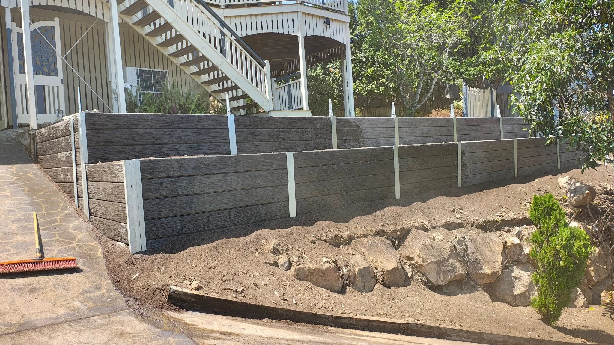 Finished concrete sleeper retaining wall